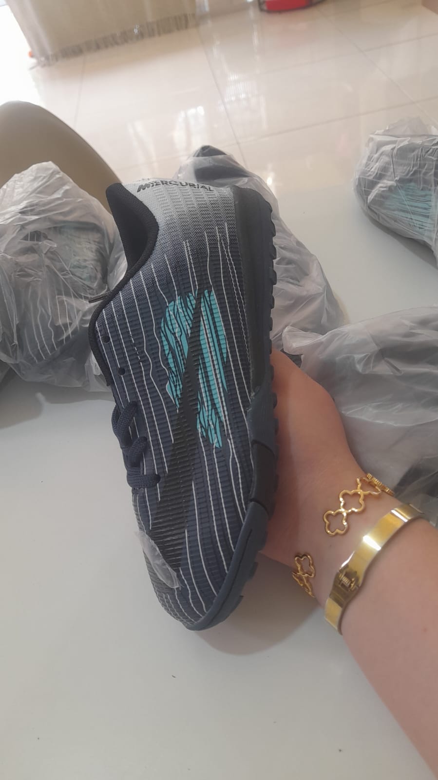Nike Mercurial kids dark navy turf football shoes with teal swoosh and white pinstripes