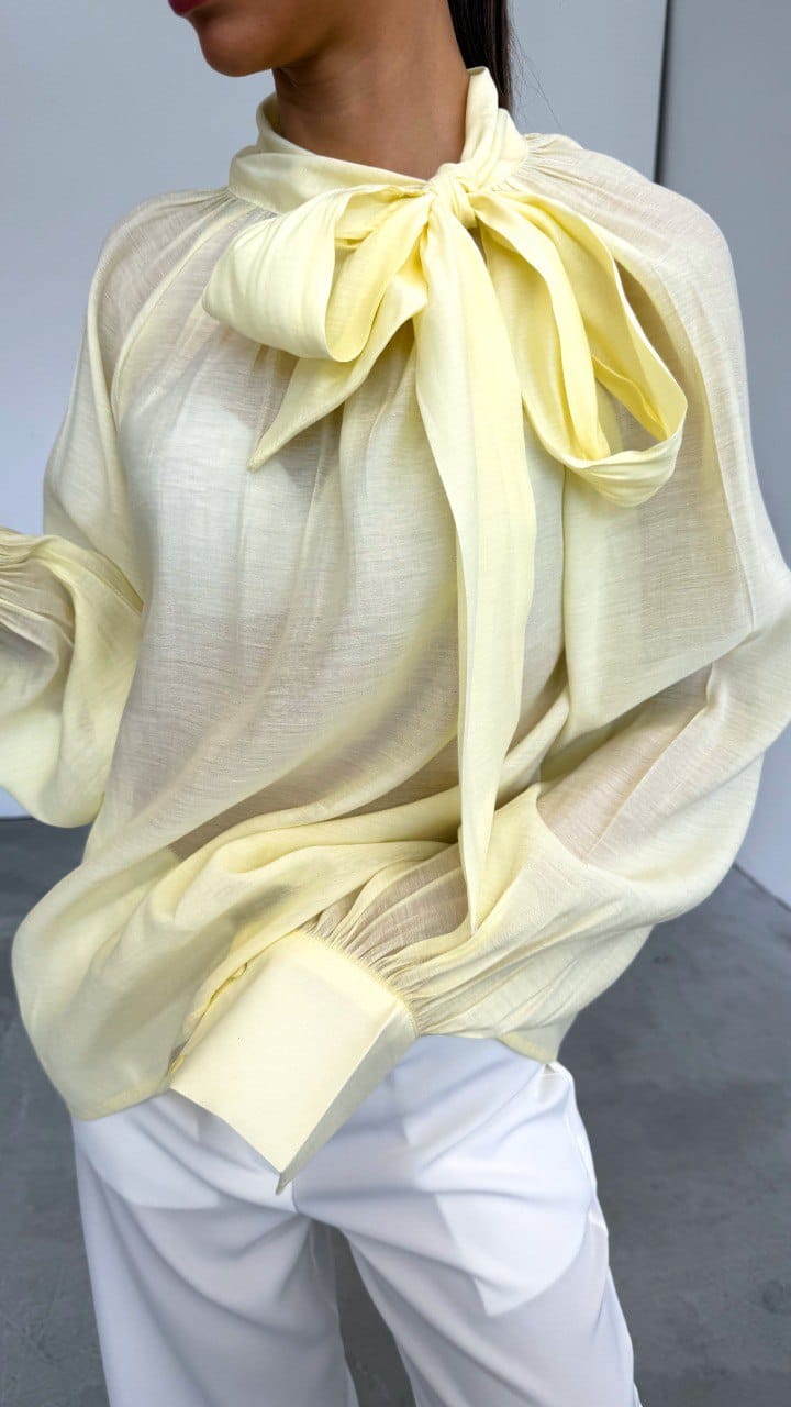 Butter Yellow sheer blouse with a bowtie on the neck. image 0