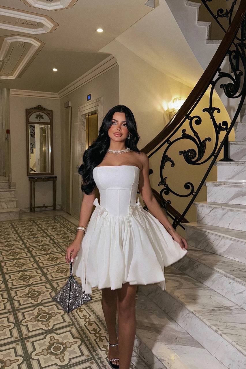 white strapless mini dress with bow ties on the waist. image 3