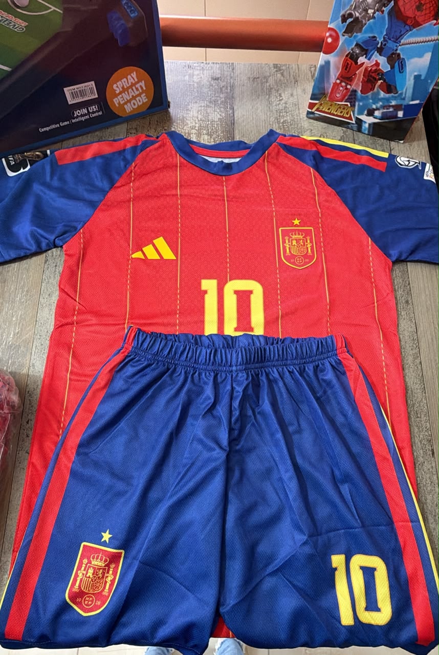 Spain Adidas kids football kit number 10 red jersey with blue sleeves and blue shorts flat lay