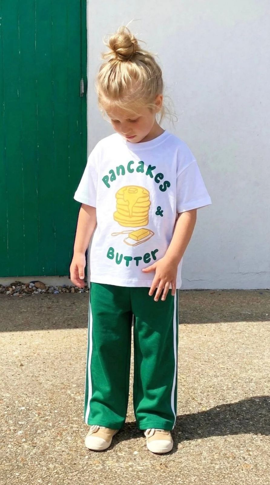 Unisex Cotton Set Featuring a White T-shirt with a Pancake Graphic and Green Track Pants with White Stripes