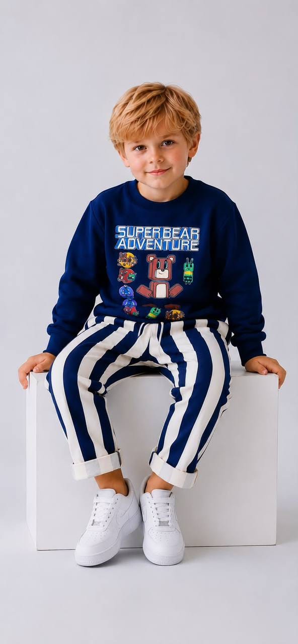 Boy wearing Super Bear Adventure navy sweatshirt with striped joggers