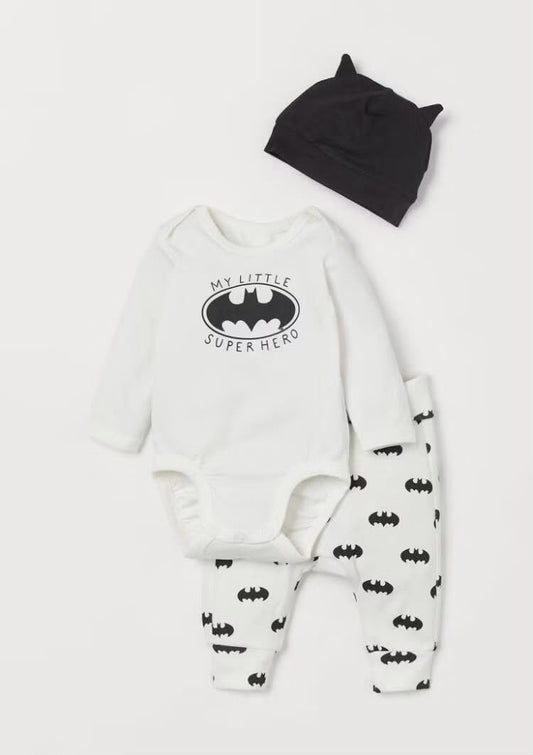 Black and white little superhero baby set with bodysuit, printed pants, and hat