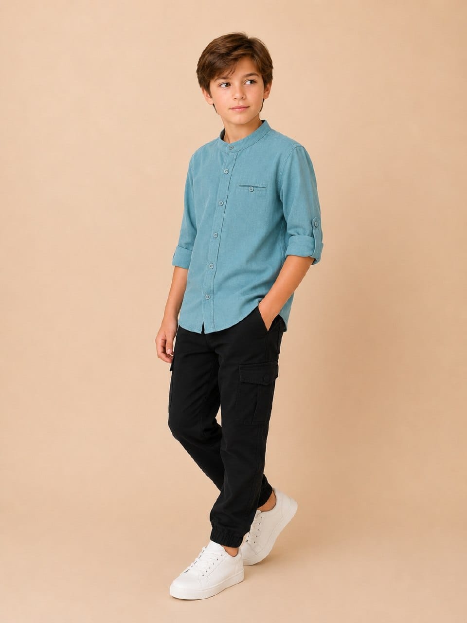 Boy wearing a teal mandarin-collar button-up shirt with rolled sleeves