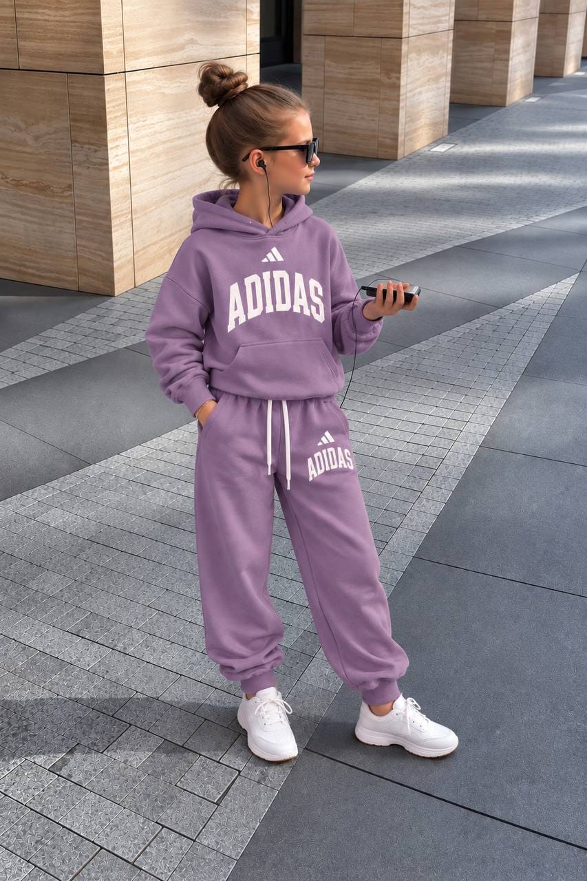 Child wearing lilac Adidas hoodie and matching joggers