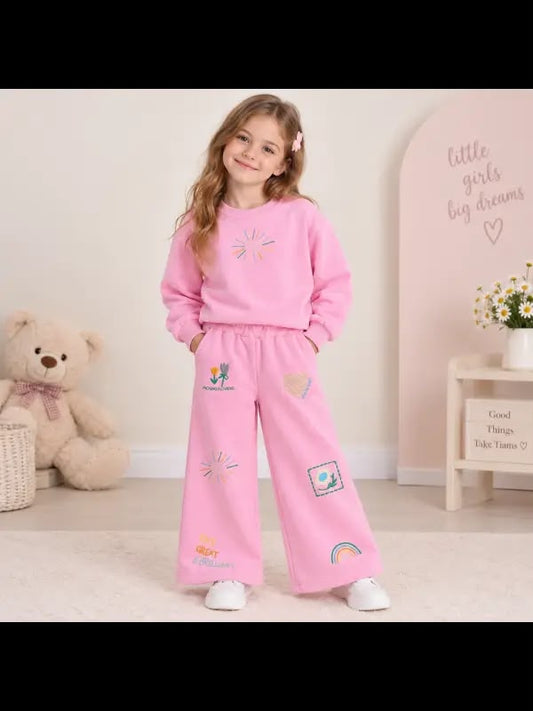 Girls' pink graphic sweatshirt and matching wide-leg pants with colourful flower and rainbow motifs