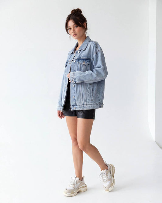 Woman wearing a light-blue oversized denim jacket