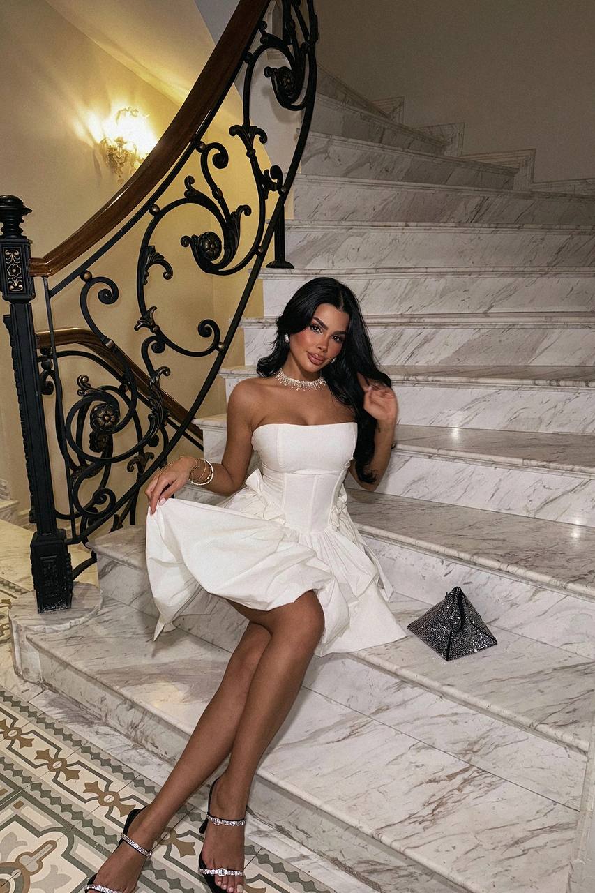 white strapless mini dress with bow ties on the waist. image 5