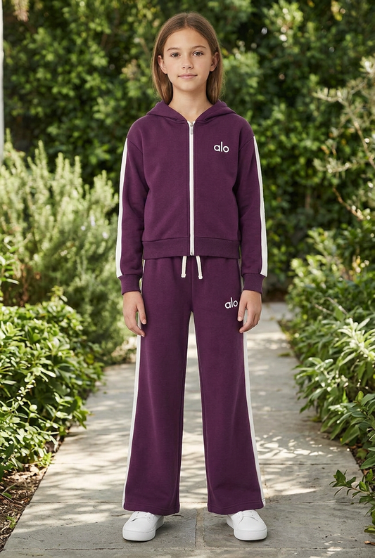 Girl wearing the purple set in a garden setting with slightly longer pants