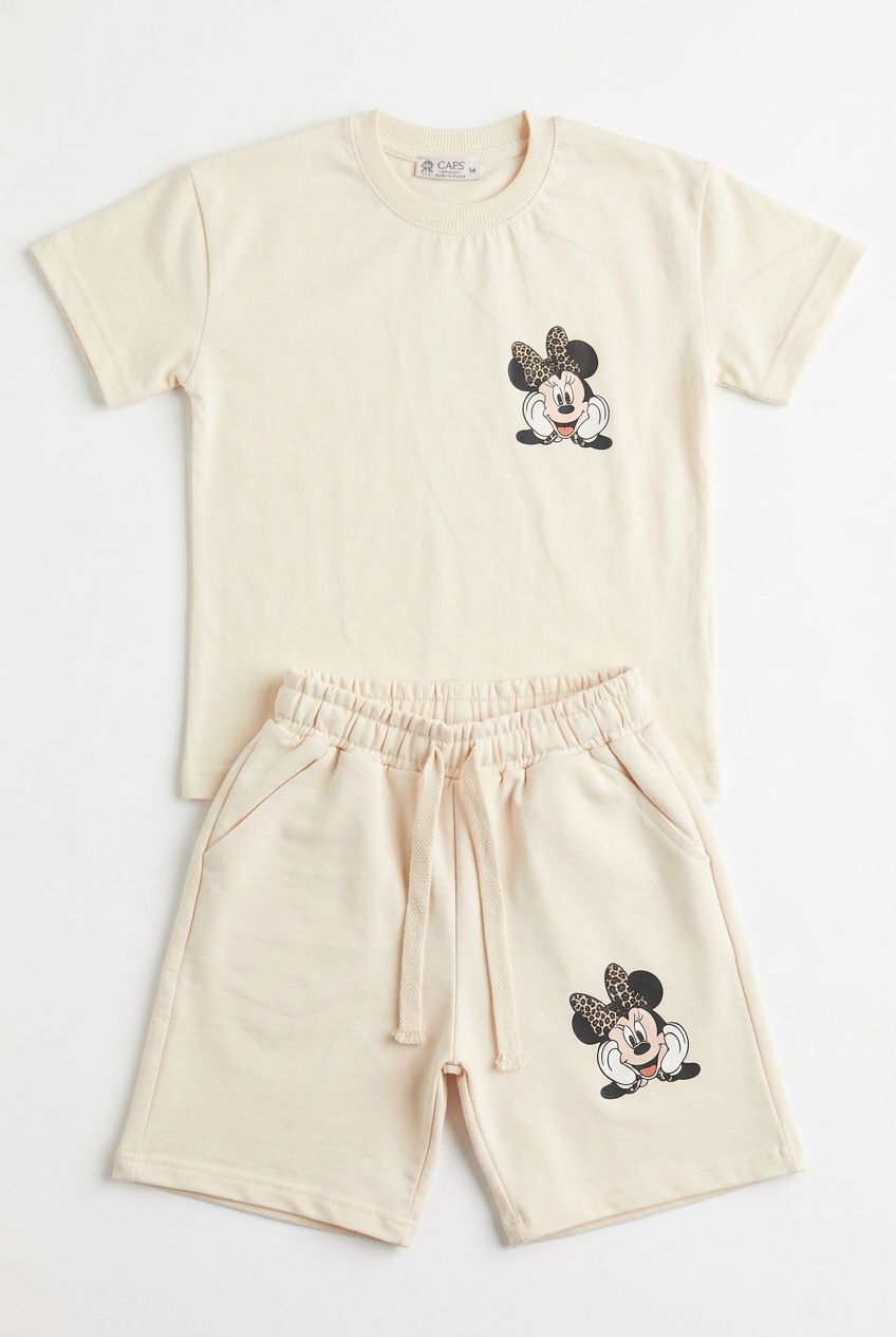 Cream Minnie Mouse top and shorts set on a white background
