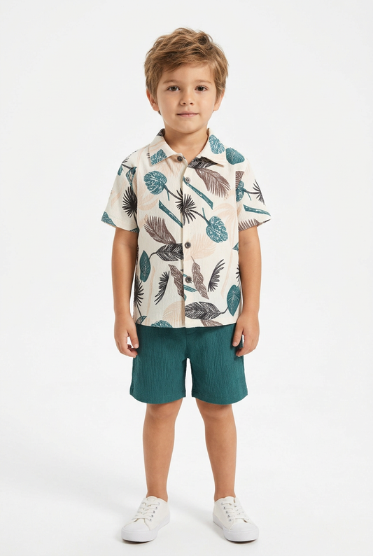 Boy wearing ivory botanical shirt and textured teal shorts