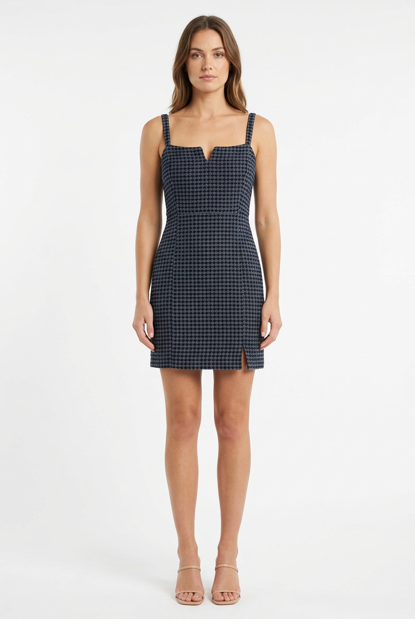 Adult woman modeling the dark woven strappy dress