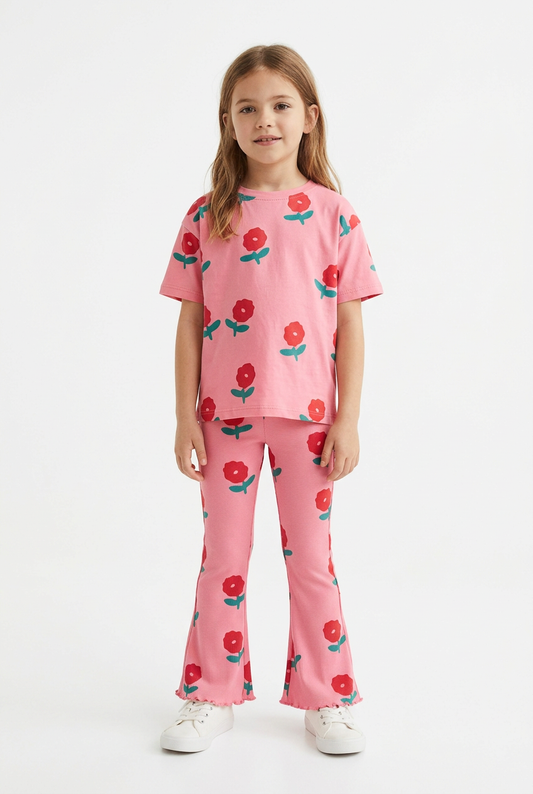 Girl wearing pink floral top and flared leggings set