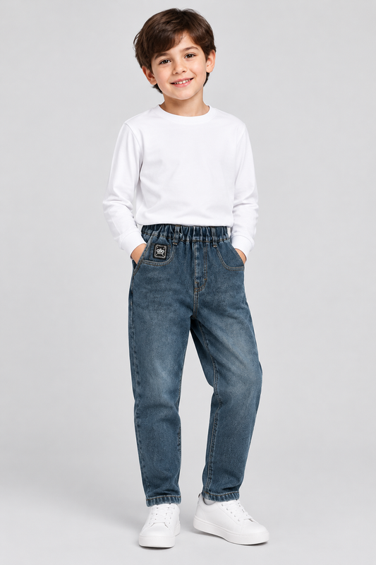Boy modelling blue fleece-lined elastic-waist jeans
