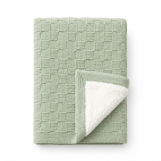 Mint-green textured knit baby blanket with white plush lining