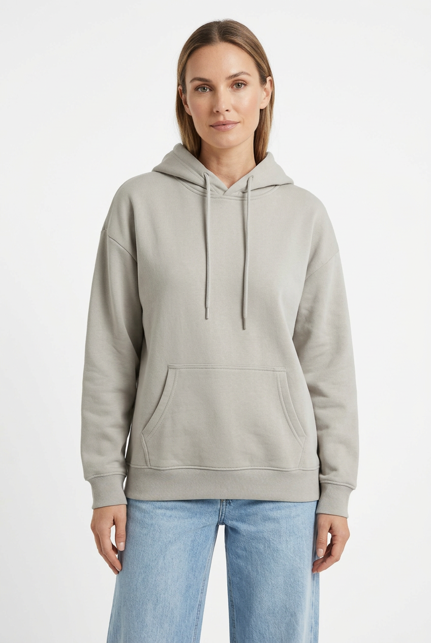 Stone-gray hoodie styled on a woman model with light-wash jeans against a white background
